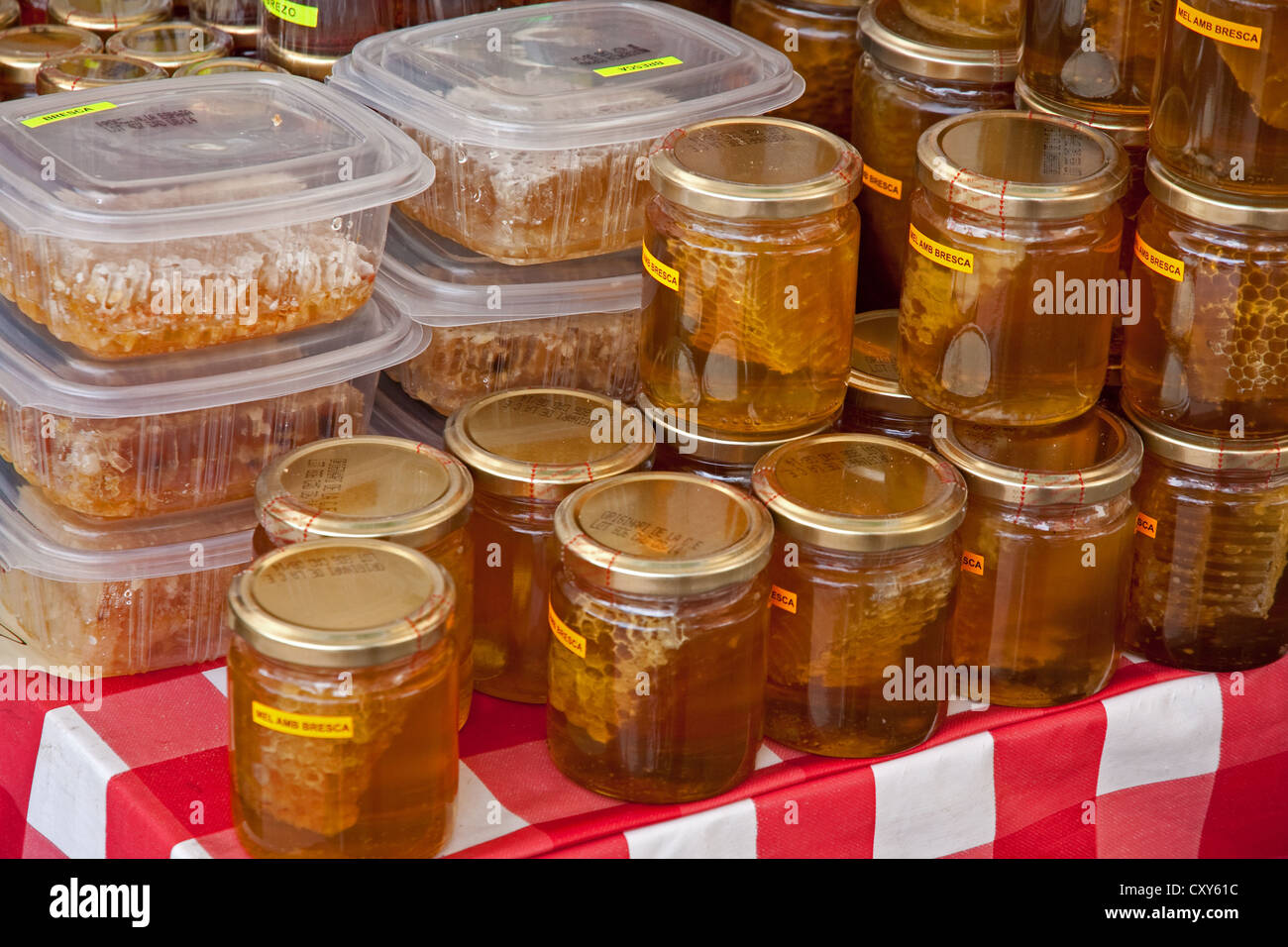 Jars of honey and cartons of honey comb for sale on roadside stall, Spain Stock Photo