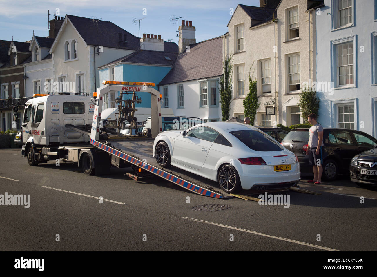 Modern Audi sports coupe car being rescued from roadside in UK Stock Photo