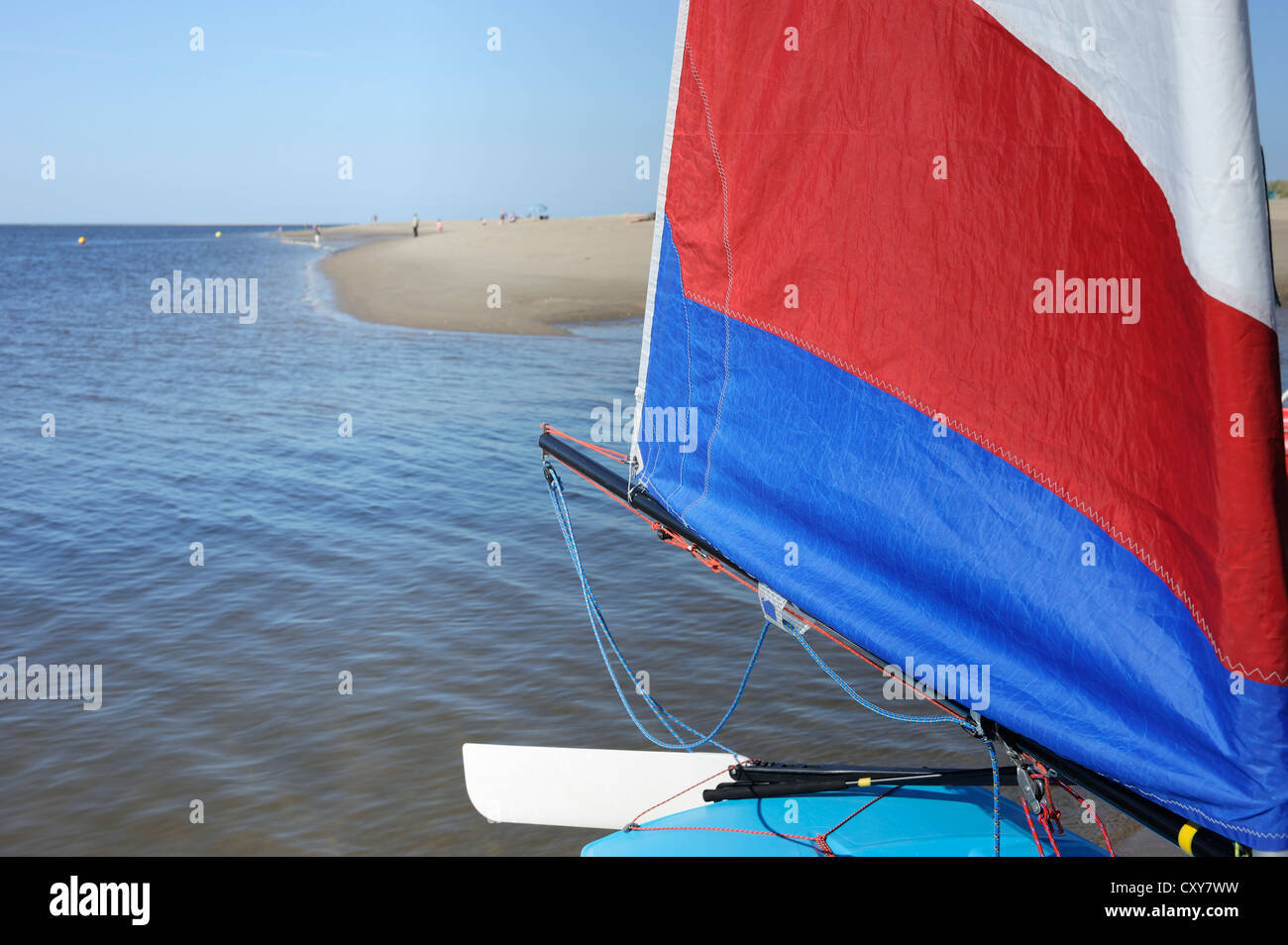 Dingy sail near a beach Stock Photo