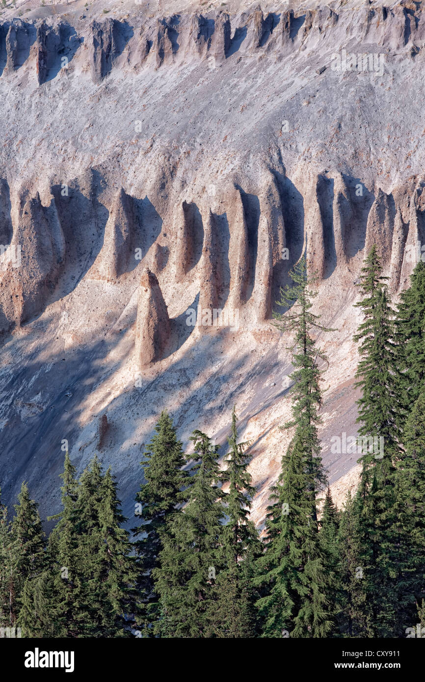Volcanic formed hoodoos emerge from the walls of Annie Creek Canyon in Oregon’s Crater Lake National Park. Stock Photo