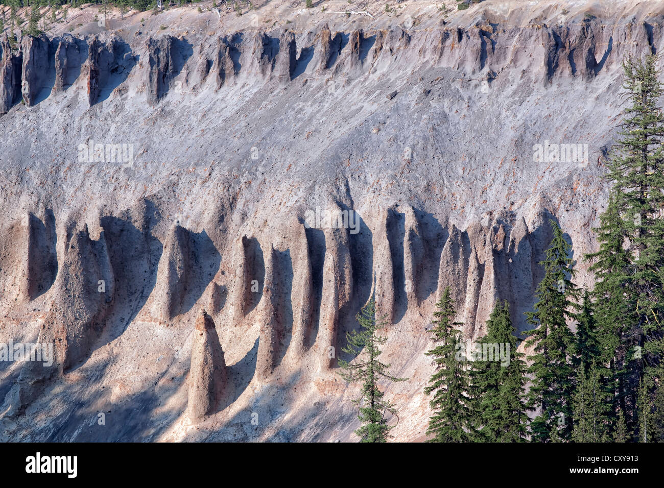 Volcanic formed hoodoos emerge from the walls of Annie Creek Canyon in Oregon’s Crater Lake National Park. Stock Photo