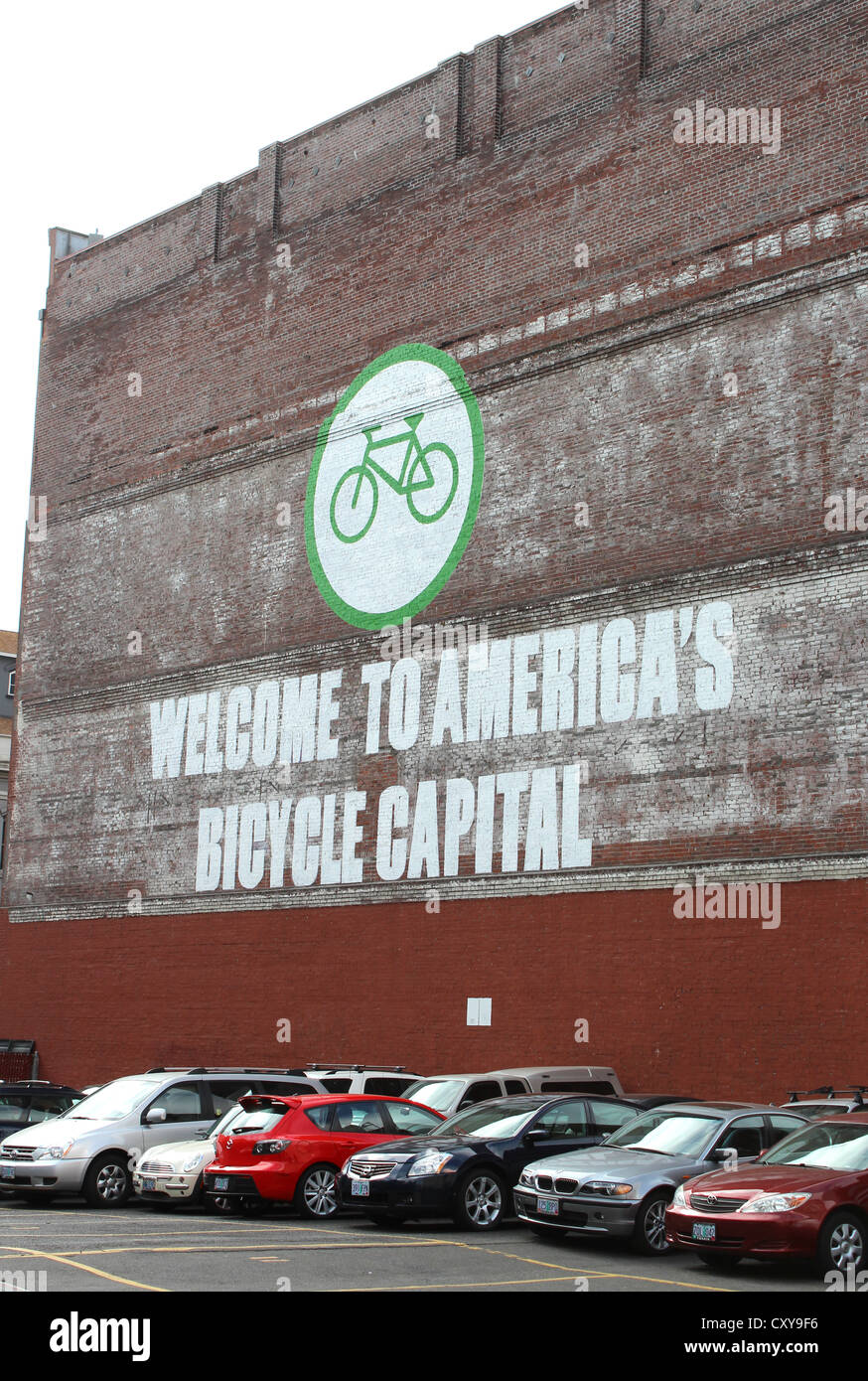 Bicycle capital sign in full car park, Portland, Oregon, USA Stock Photo