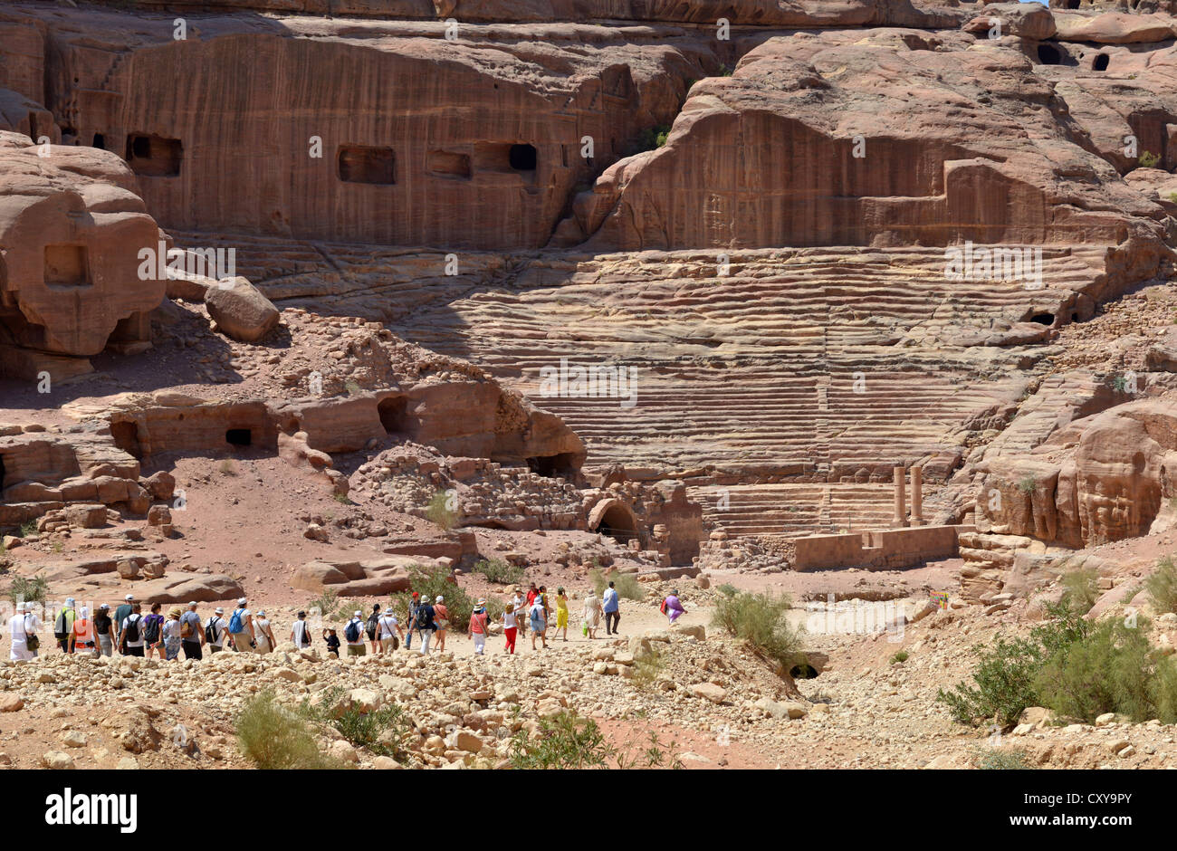 Petra, Jordan. Tourists make their way to the amphitheatre at Petra, Jordan. Stock Photo
