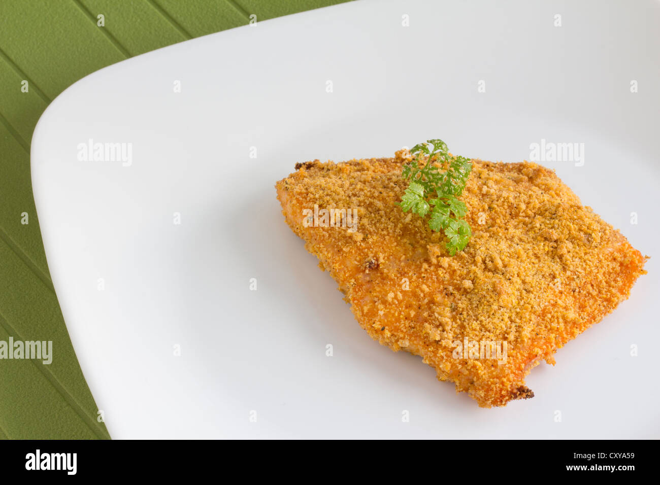 Baked food in breadcrumbs - Stock Image