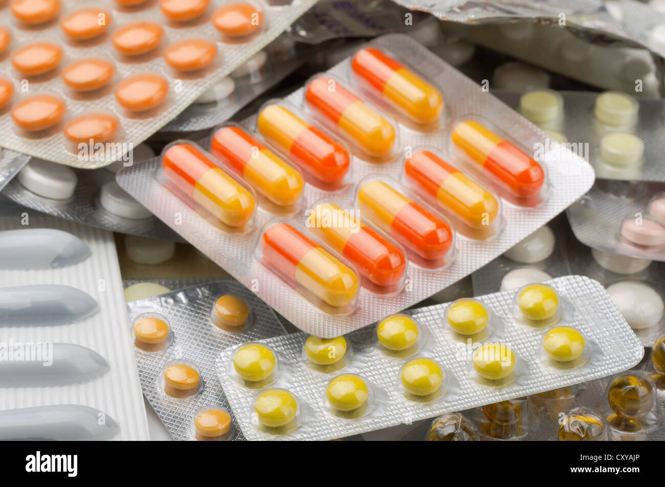 Close up of assorted pills in blister packs Stock Photo
