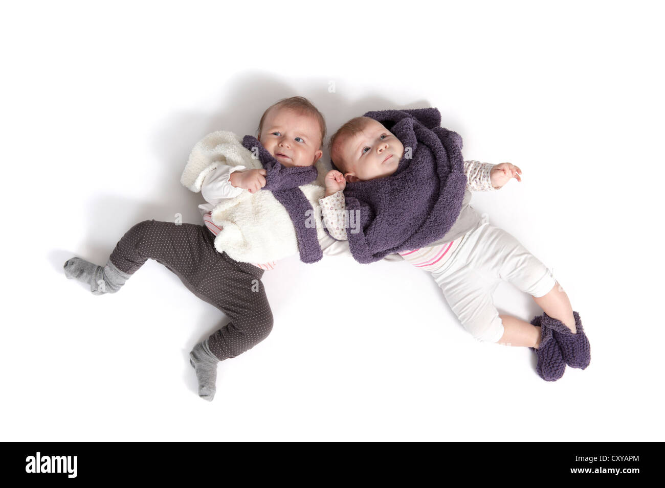 two babies lying on the floor Stock Photo Alamy
