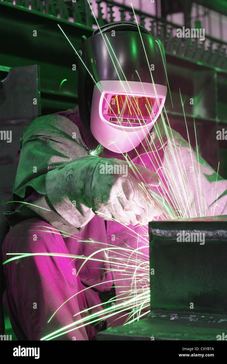 Welder wearing protective clothing in a steel mill Stock Photo Alamy