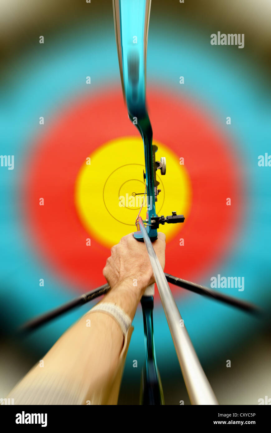 Archery, archer aiming towards a target Stock Photo