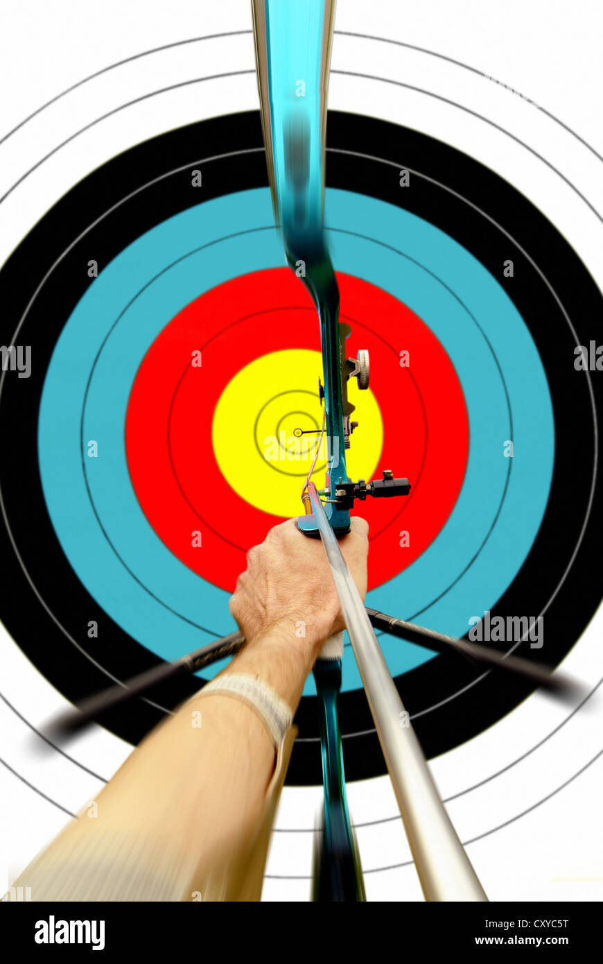 Archery, archer aiming towards a target Stock Photo