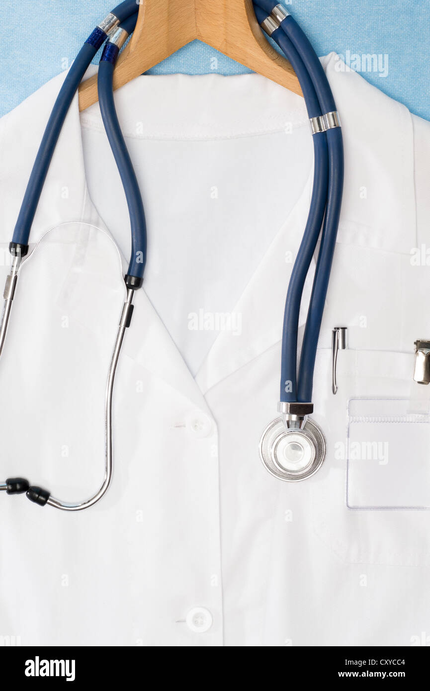 Medical lab coat and stethoscope hanging on hanger Stock Photo Alamy