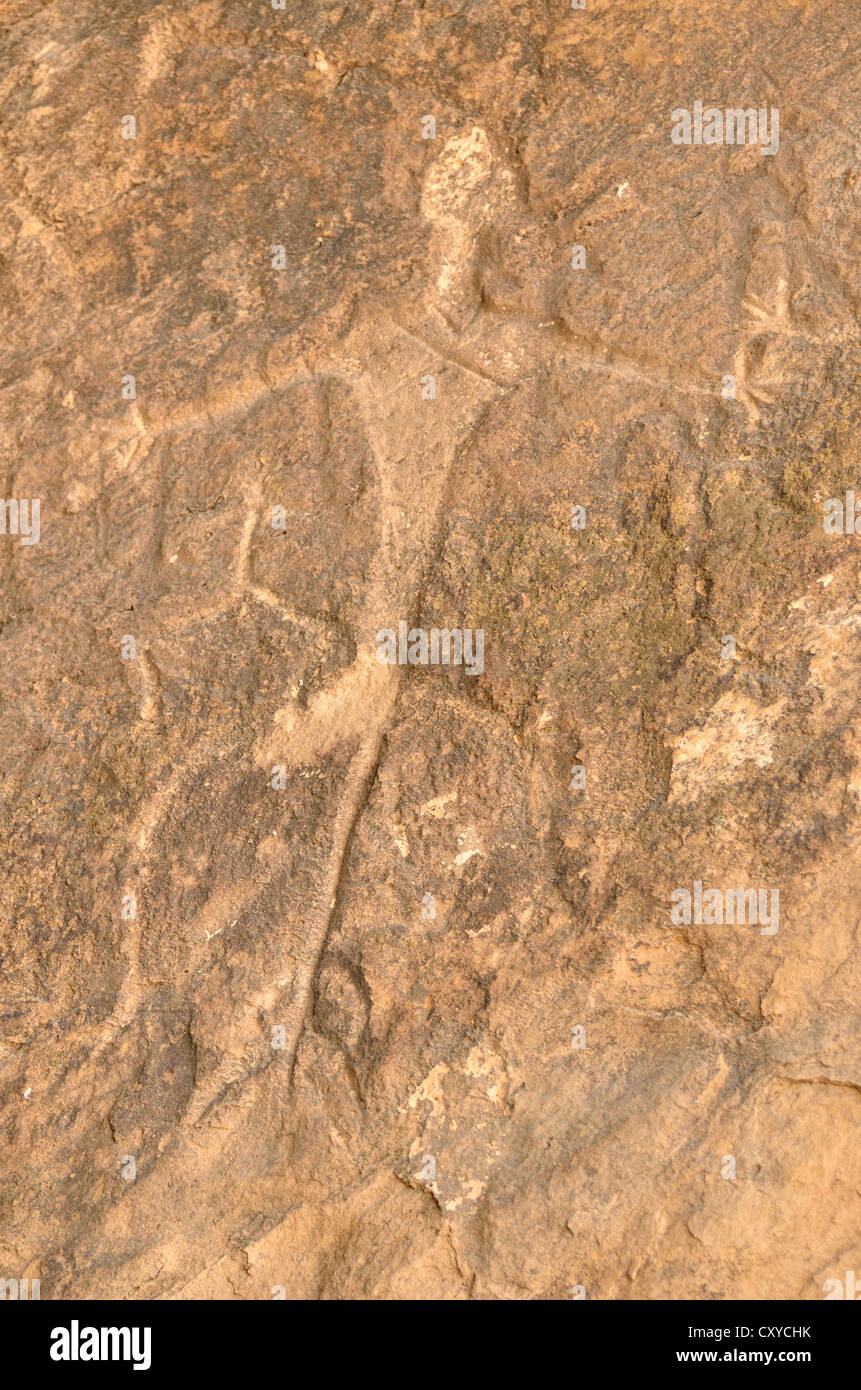 Stone Age rock carving of a man in the UNESCO World Heritage site of Gobustan with about 6, 000 rock carvings up to 40, 000 Stock Photo