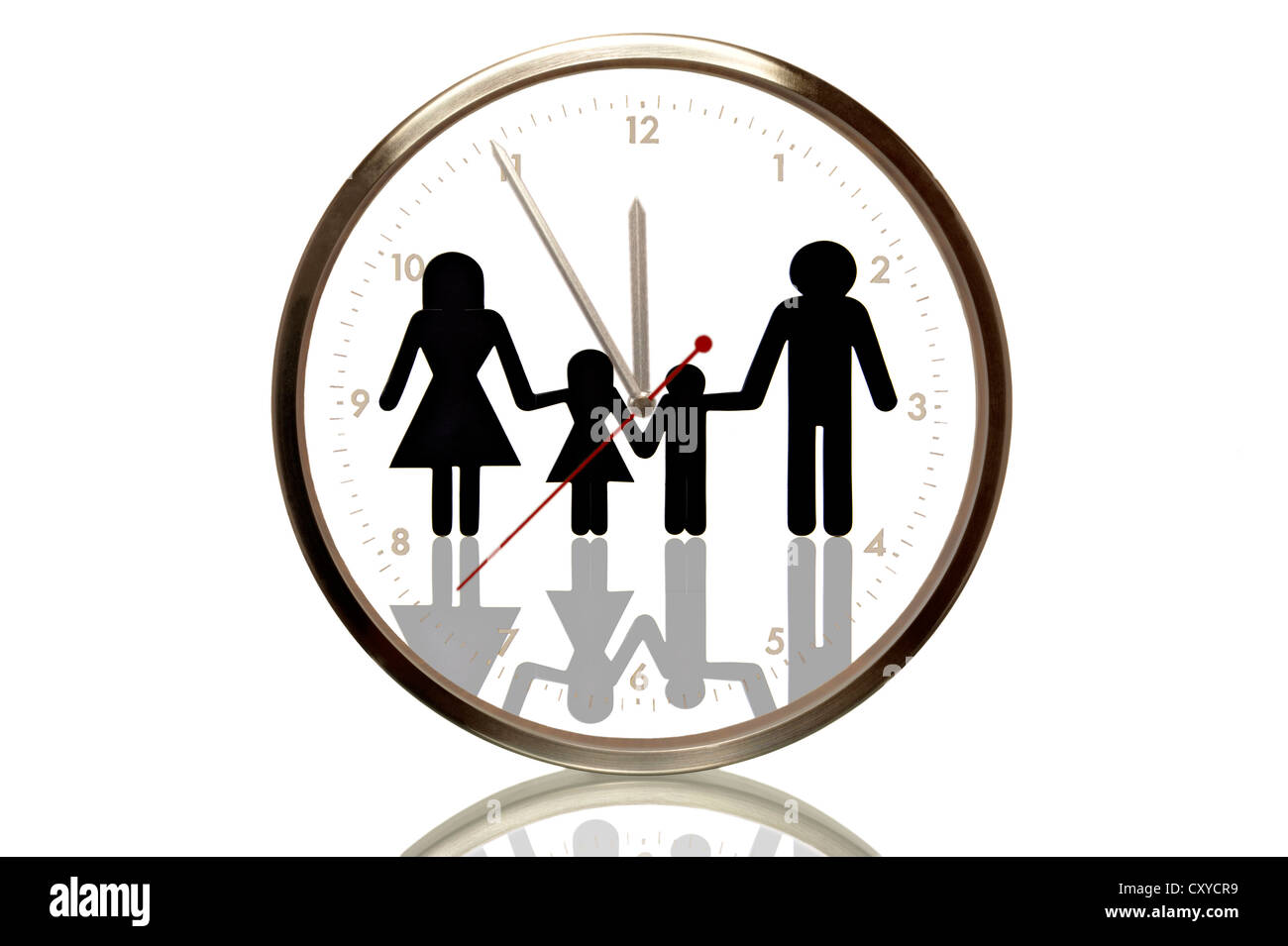 Clock with a family, 5 minutes to twelve, eleventh hour, symbolic image for demographic outlook Stock Photo