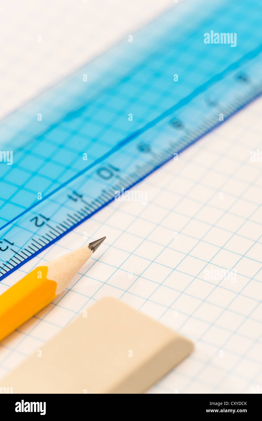 School geometry supplies pencil, rubber and ruler on square paper Stock ...