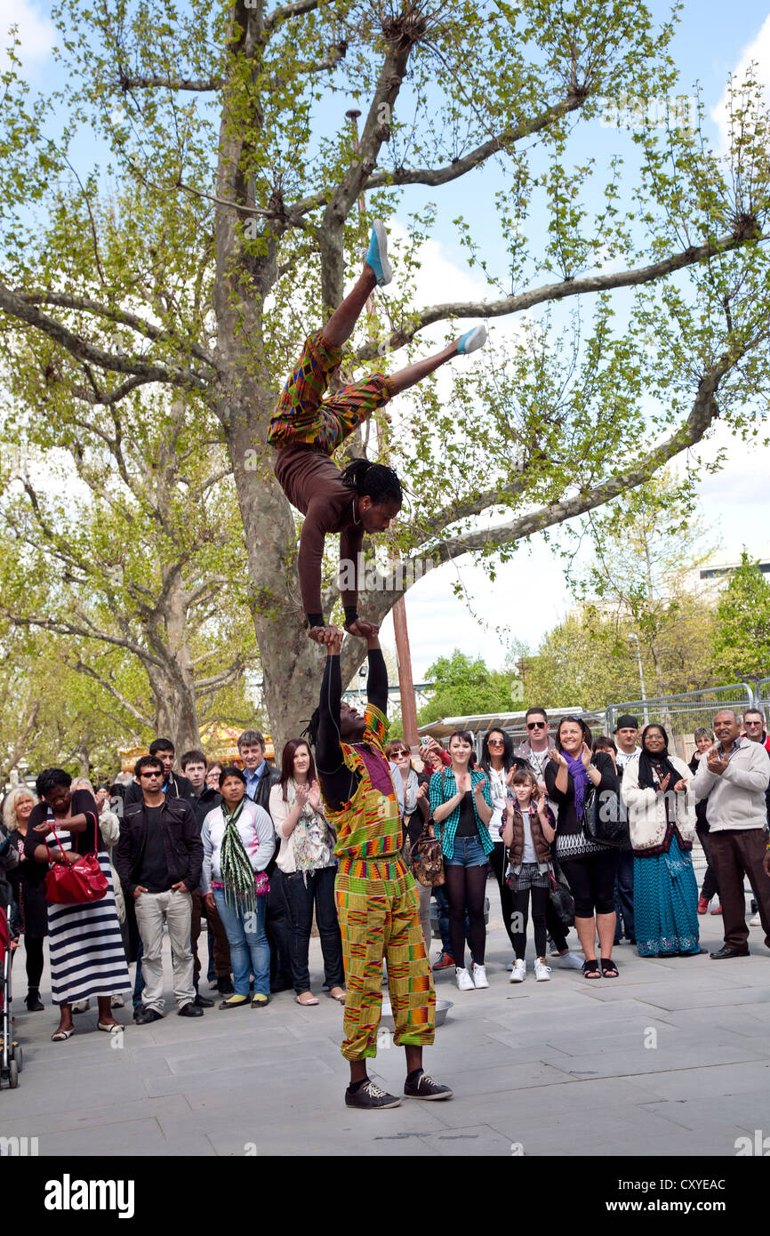 England. London. South Bank. African street performers. Acrobatics. Stock Photo