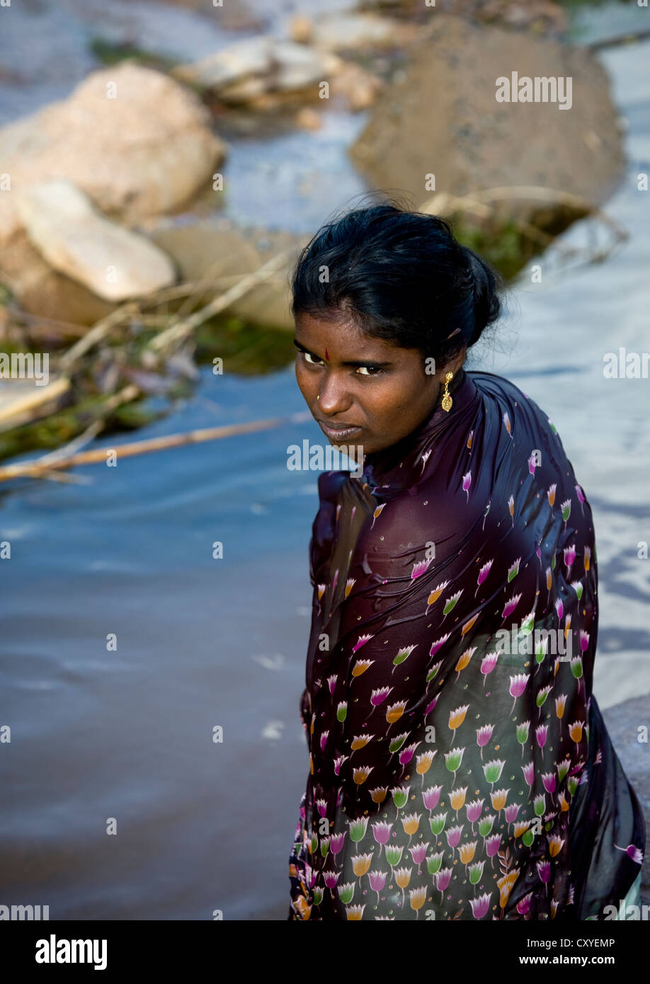 Young Soaked Woman With Dark Hairs And Eyes Getting Out Of The Water In A  Village Near Madurai, India Stock Photo - Alamy