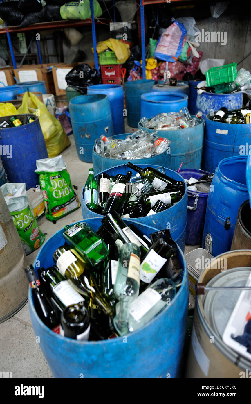 Separated recyclable materials, waste glass, medium-sized company of a women's organisation separating rubbish and selling the Stock Photo