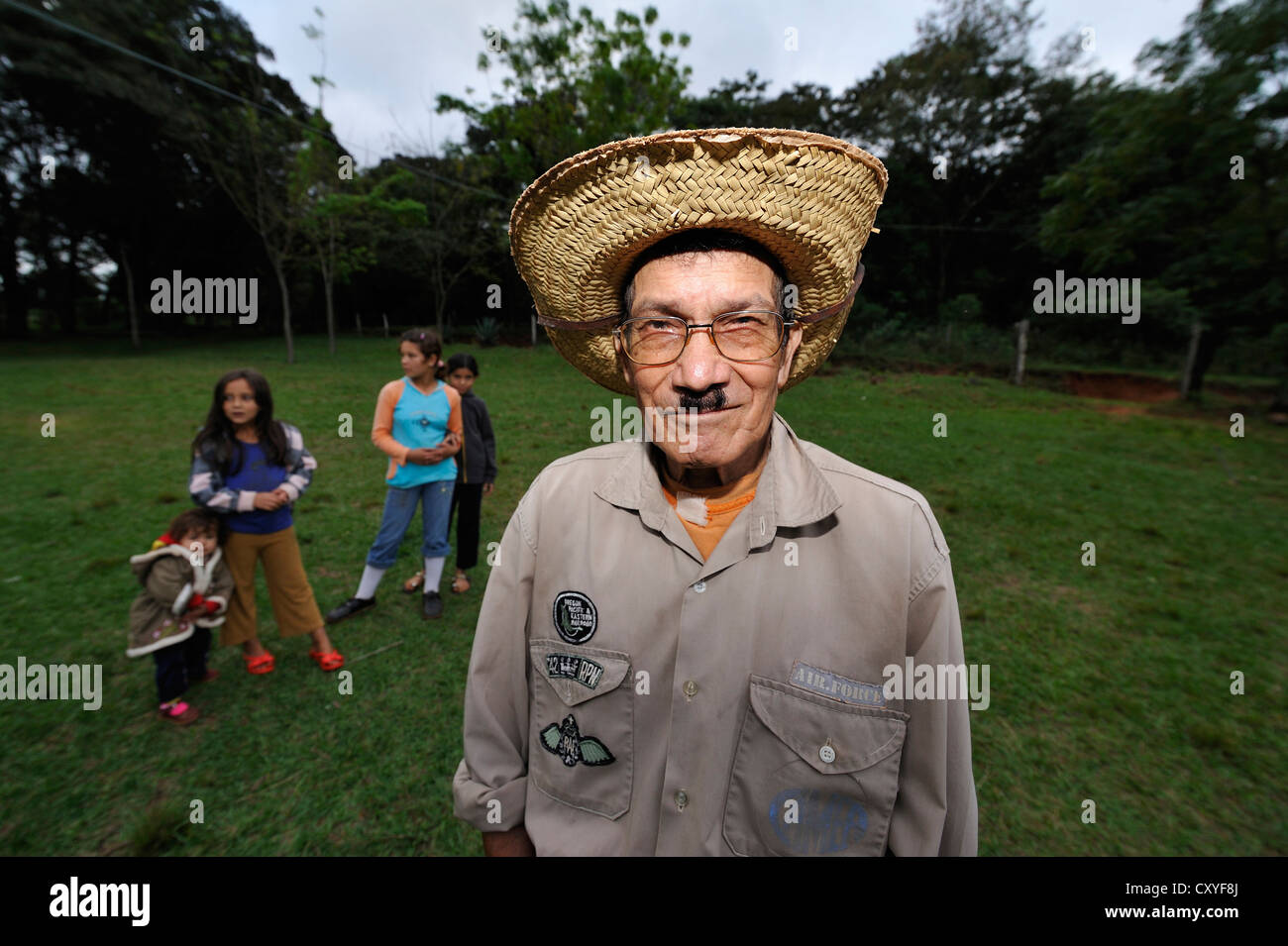 Old man with a straw hat and a moustache, Comunidad Kinta'i, Caaguazu, Paraguay, South America Stock Photo
