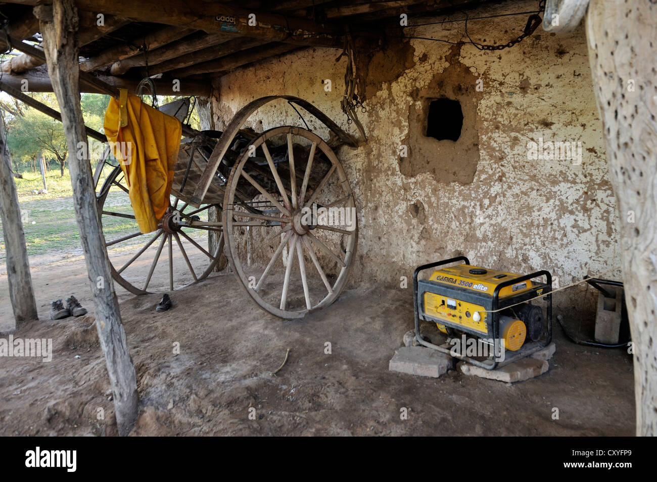 Generator and ox-cart on a small farm, Gran Chaco, Santiago del Estero Province, Argentina, South America Stock Photo