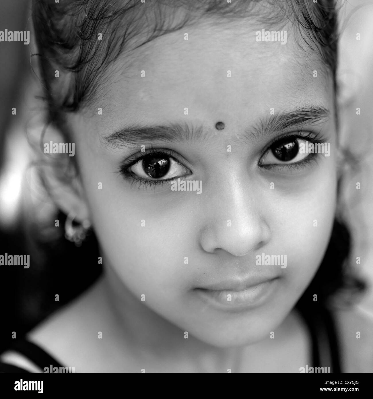 Portrait Of A Cute Young Girl During Theyyam Ceremony, Thalassery, India Stock Photo