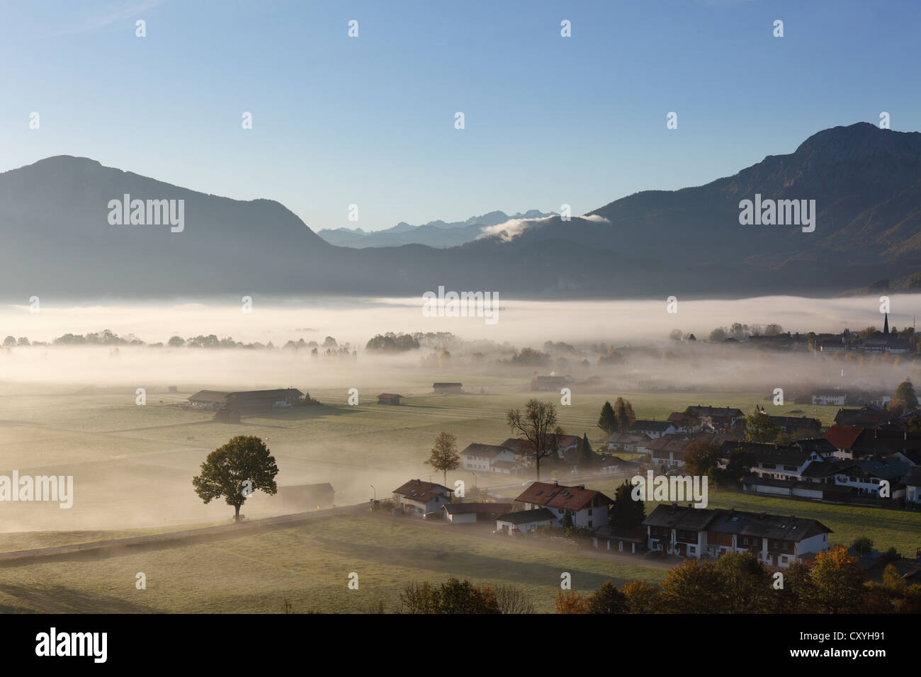 Morning fog over Loisach Moor or Loisach-Kochelsee-Moor, Kleinweil, right, Grossweil community, Mt Kesselberg at back Stock Photo