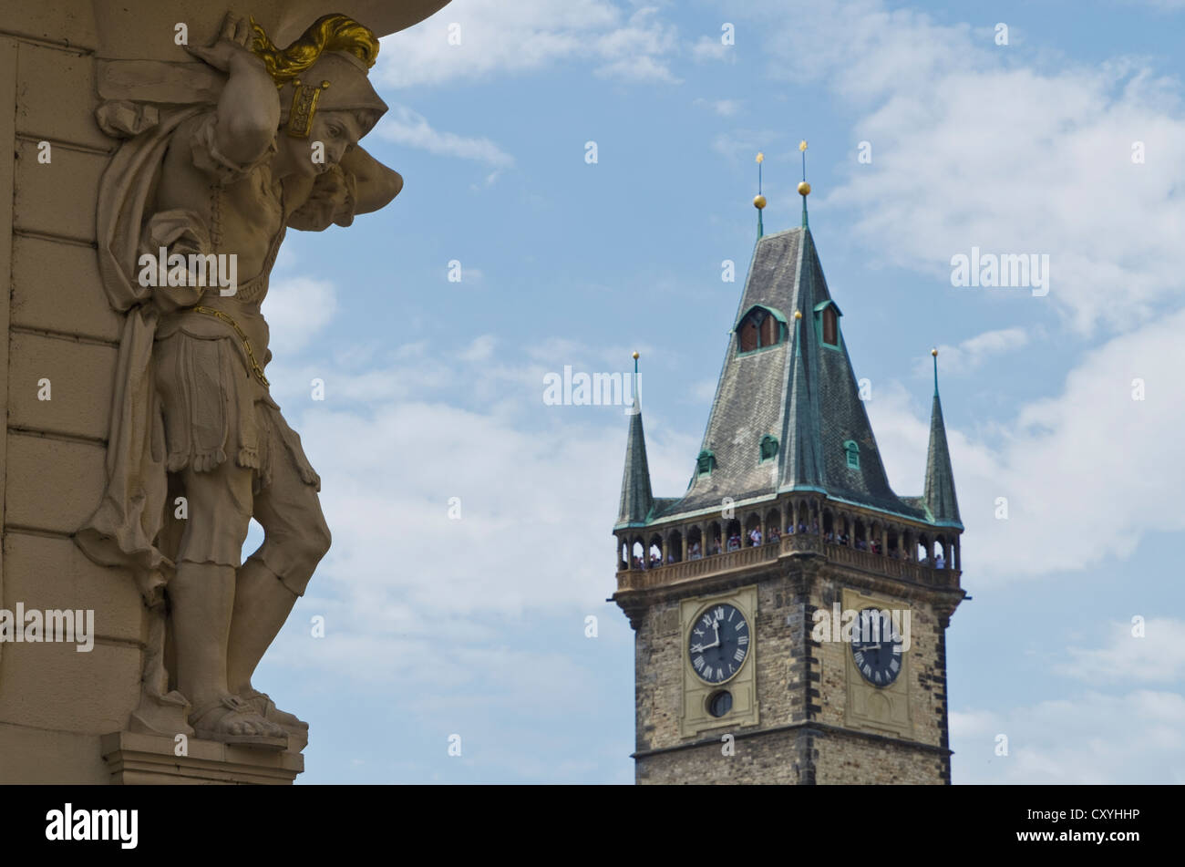 Sculptural detail of a restored facade with the tower Prague's town hall at back, Prague, Czech Republic, Europe Stock Photo