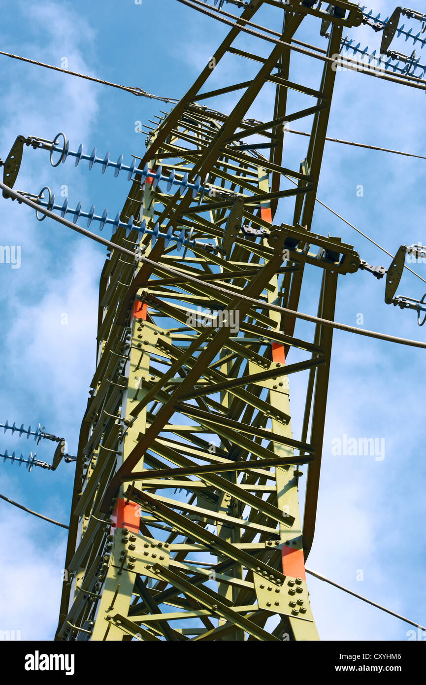 Electricity pylon against blue cloudy sky Stock Photo - Alamy