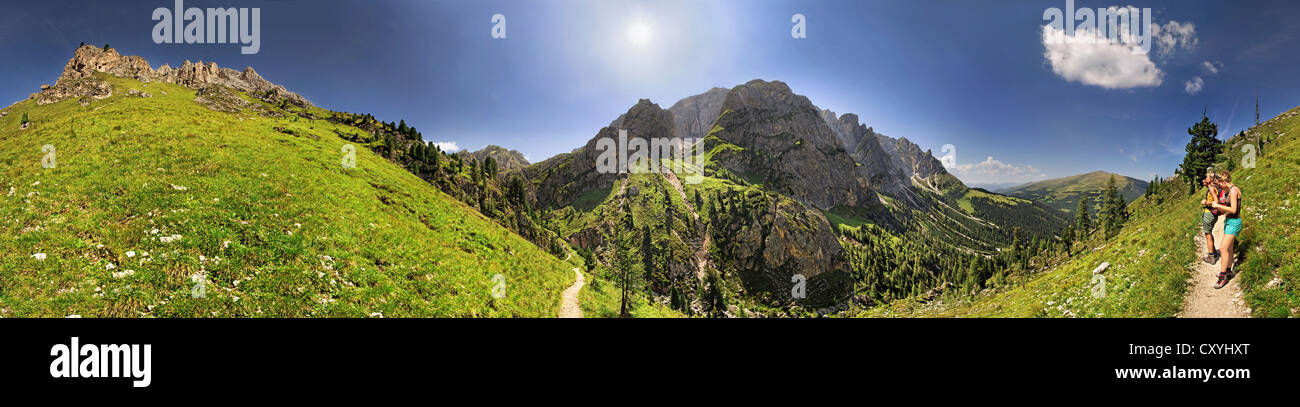 360° panoramic view from Mt Aferer Geisler with hikers at Wuerzjoch, Passo delle Erbe, Villnoess, Funes, Dolomites, South Tyrol Stock Photo