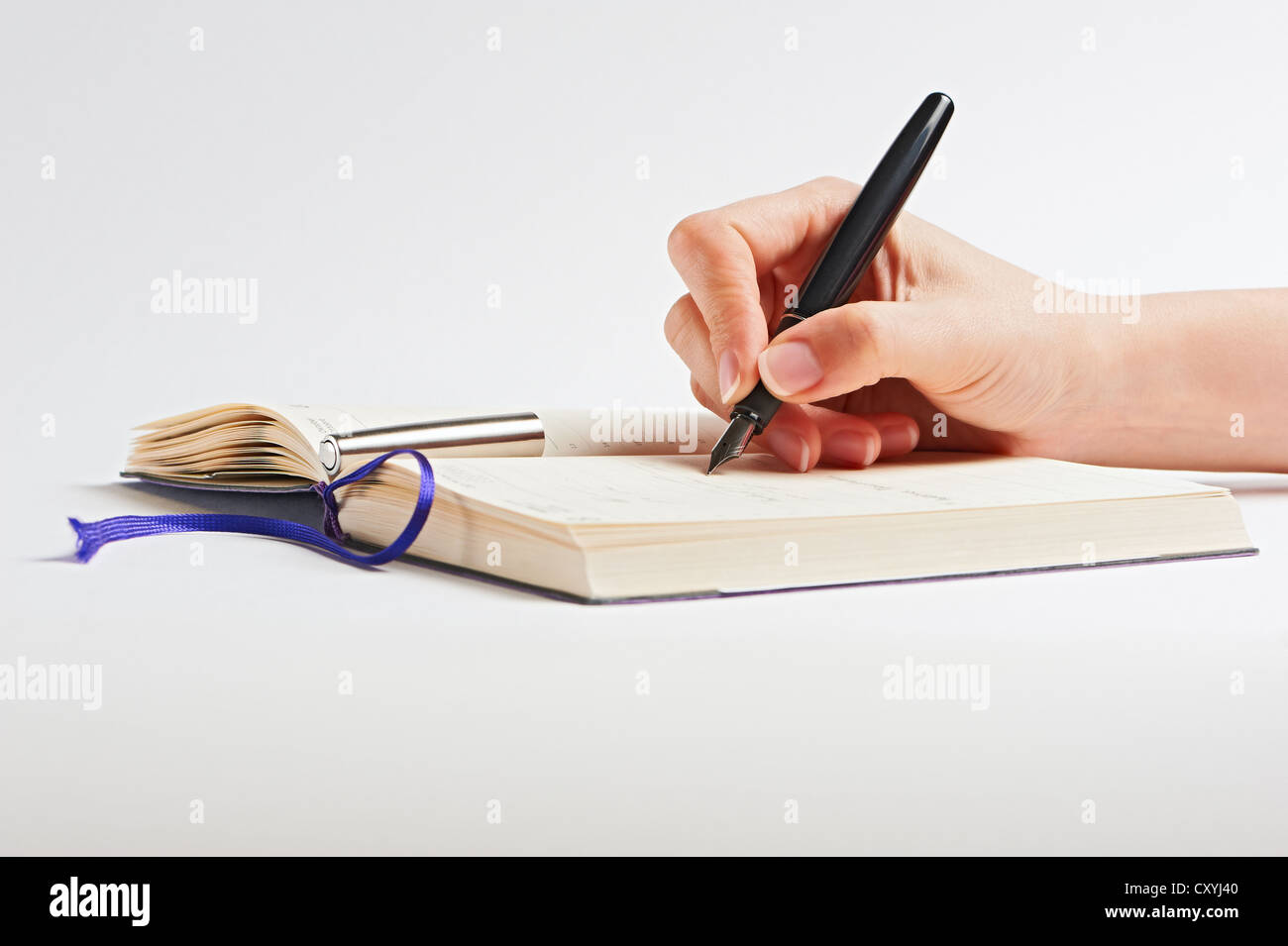 Hand with pen on white background Stock Photo - Alamy