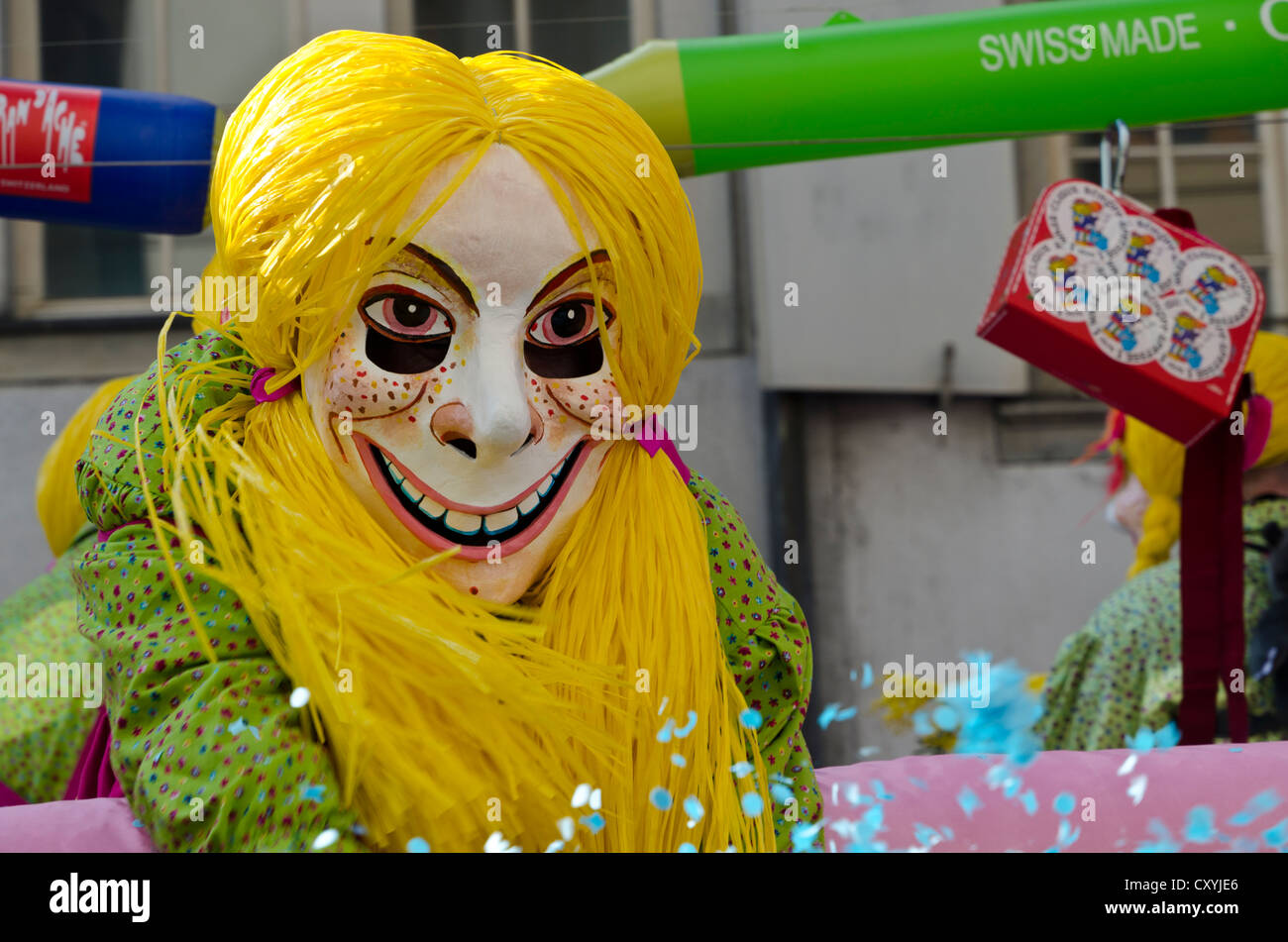 Masked people walking through the streets of Basel at 