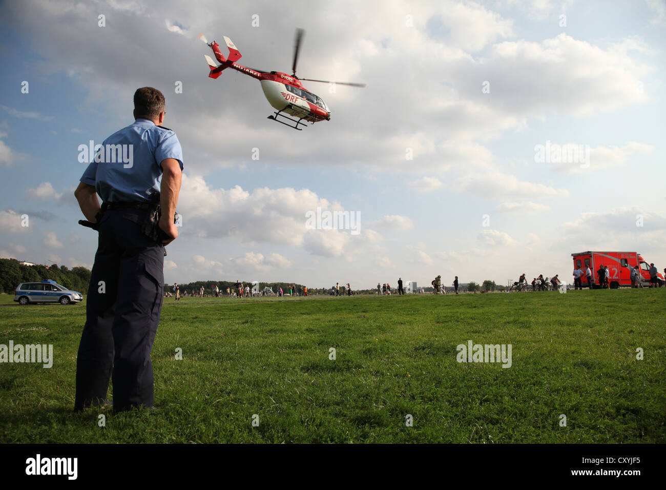 Air ambulance in action, after sustaining severe burns, a 15-year-old girl is flown by rescue helicopter from Tempelhof Field to Stock Photo