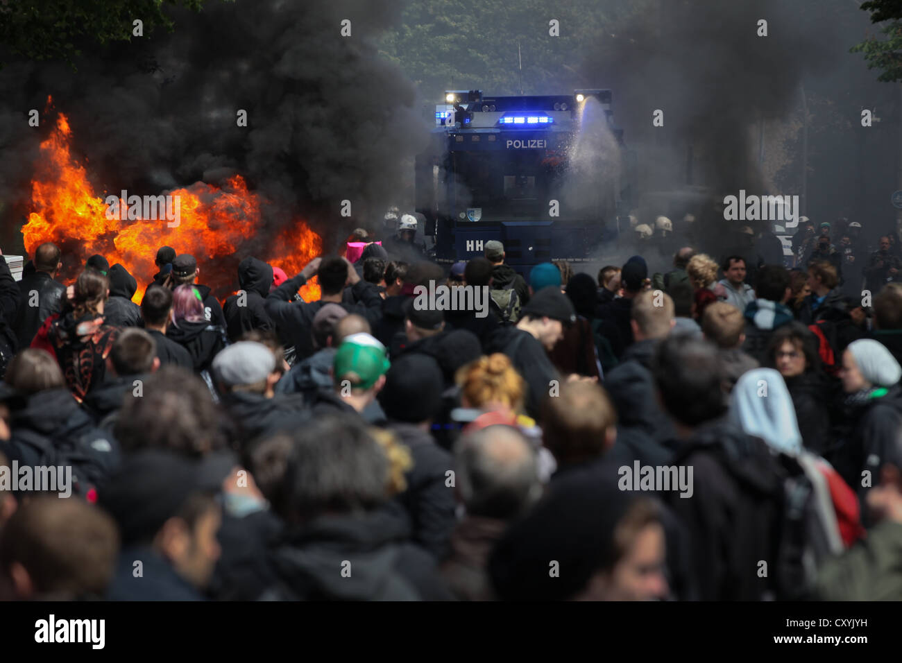 Use of water cannon against anti-Nazi protesters, the left-wing protesters tried to stop a rally of neo-Nazis with burning Stock Photo