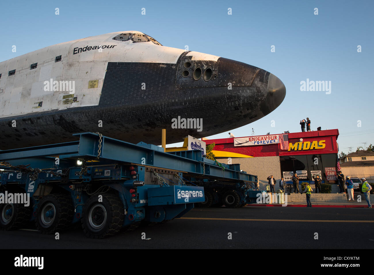 NASA space shuttle Endeavour is maneuvered streets of Inglewood while ...