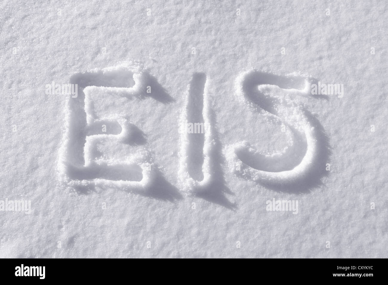 The word 'Eis', German for 'ice' drawn into freshly-fallen snow Stock Photo