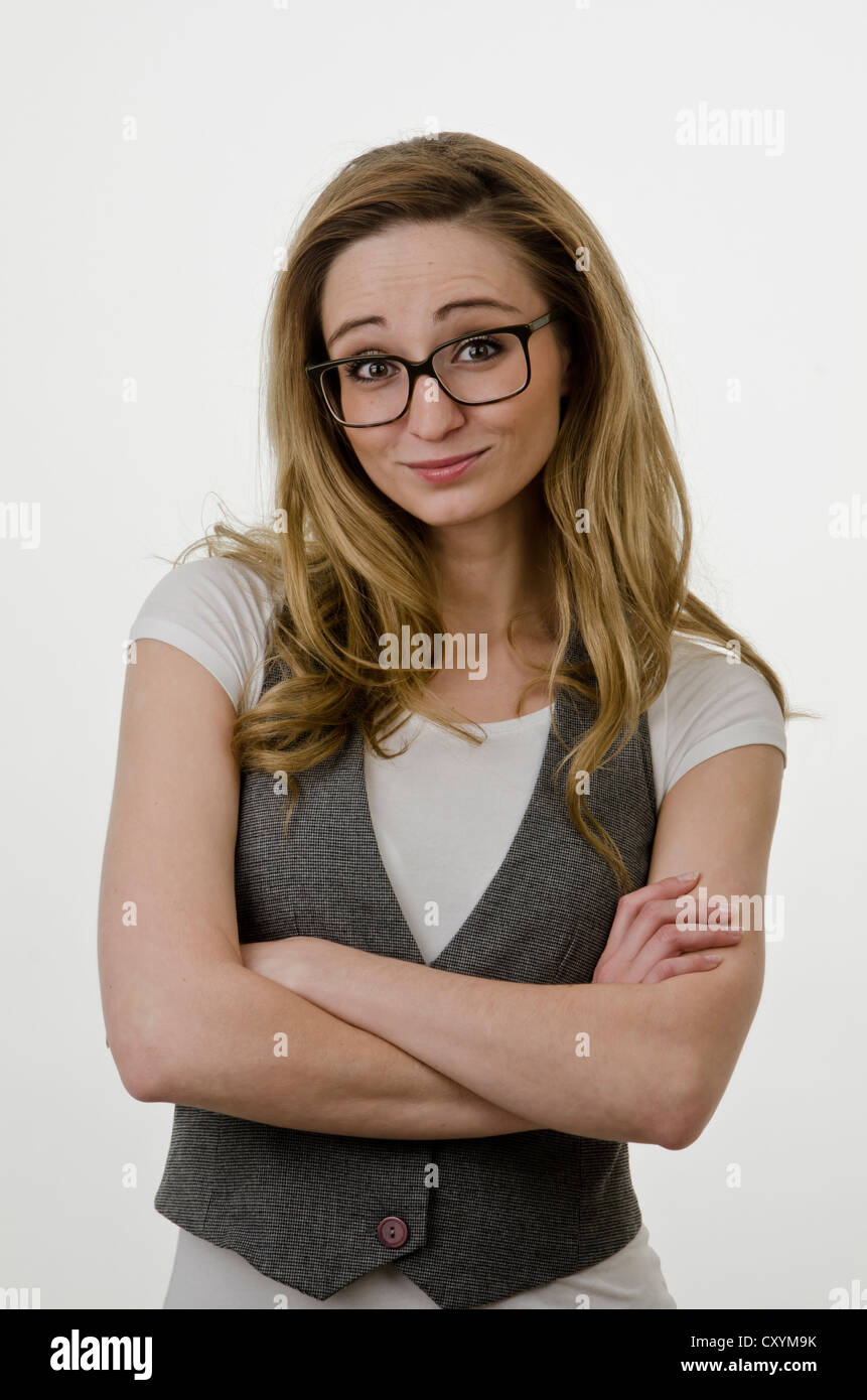 Young woman, 25, wearing large glasses, with a questioning look Stock