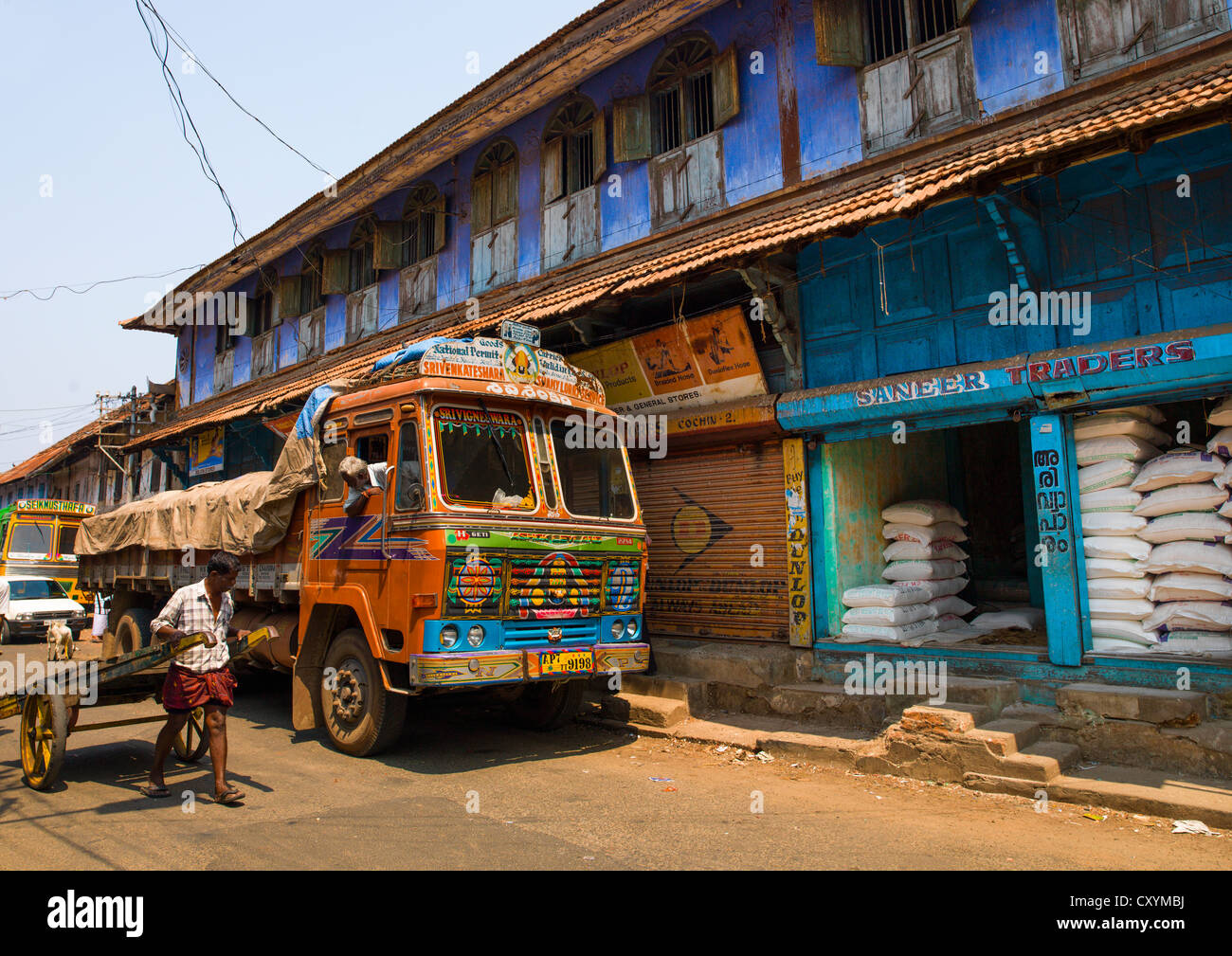 Painted Truck Parked In Front Of A Colorful House In Shopping Street Of Kochi, India Stock Photo