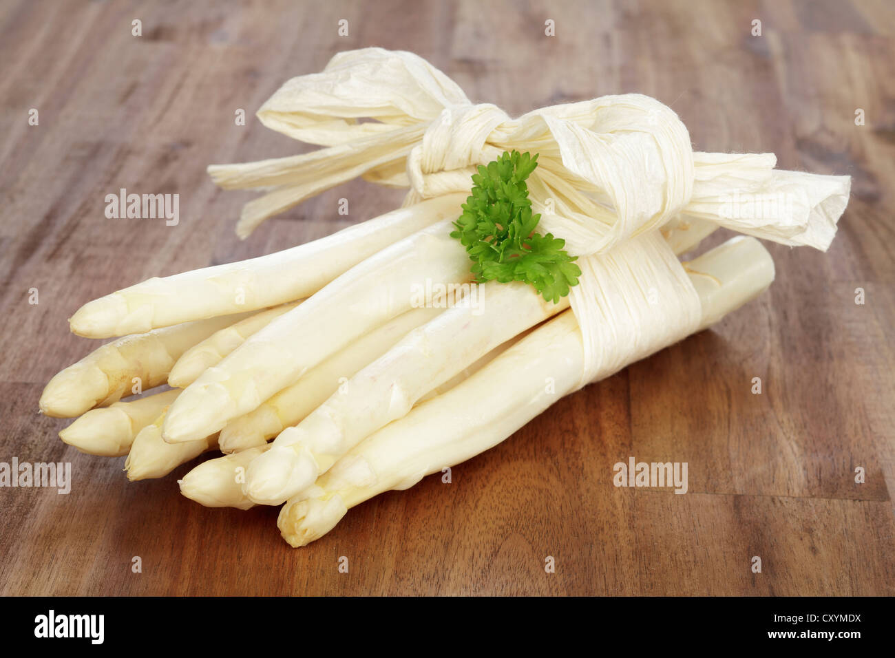 Fresh unpeeled white asparagus Stock Photo