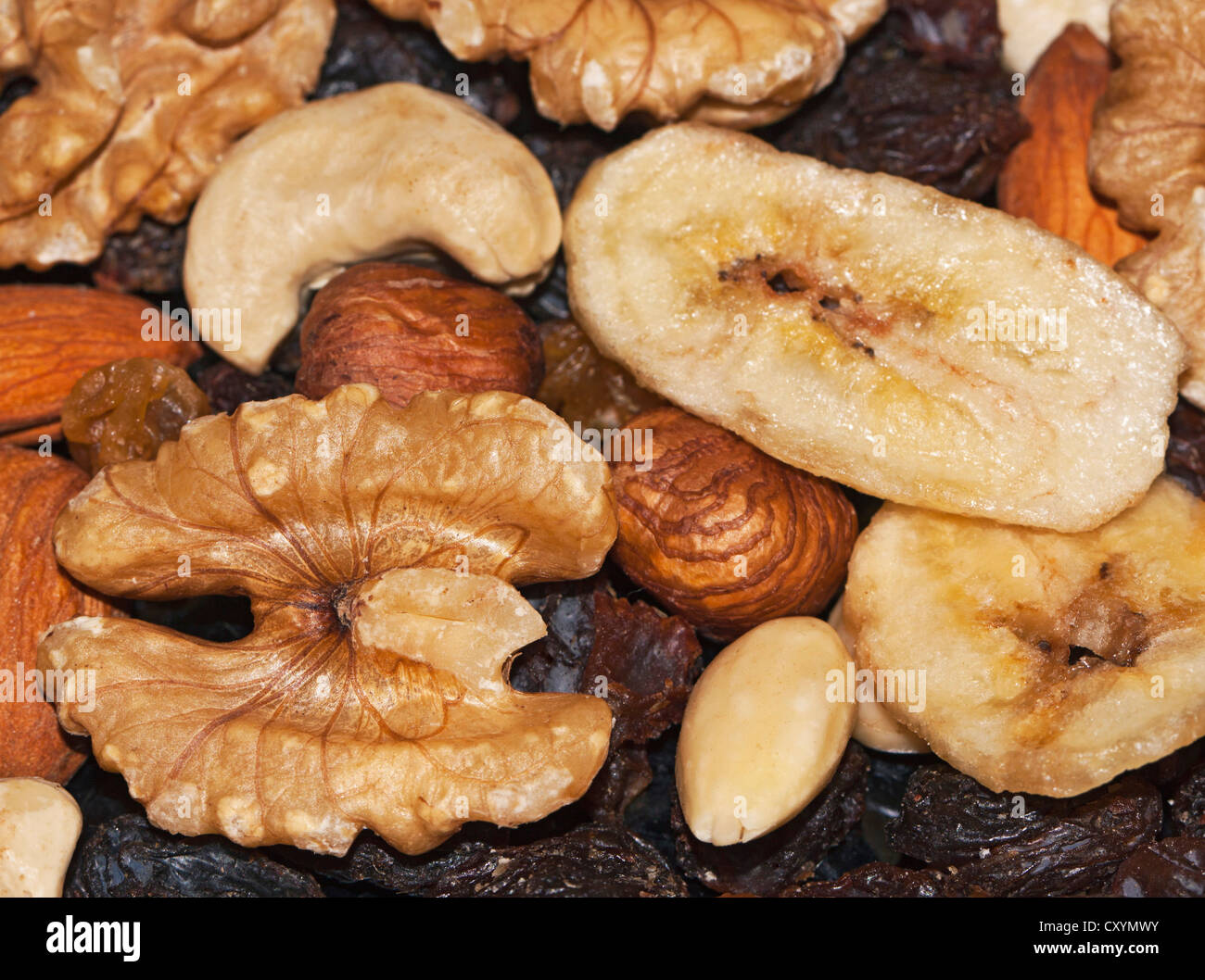 Trail mix with walnuts, dried banana chips, hazelnuts, cashews and