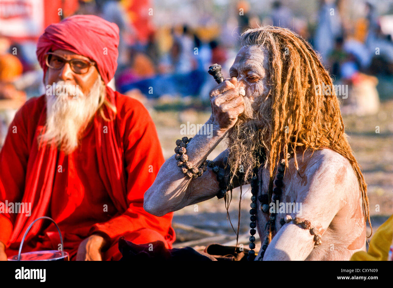 Sadhu, holy man, smoking marihuana during Kumbh Mela or Kumbha Mela, Haridwar, India, Asia Stock Photo