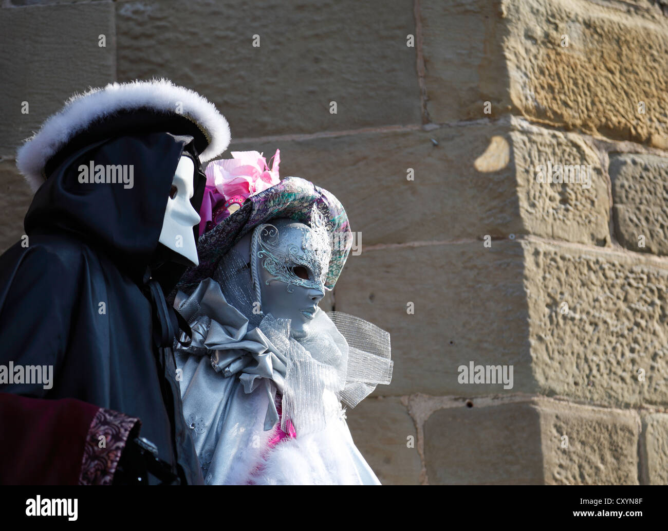 People wearing masks, one of them wearing a bauta, Hallia Venezia, Schwaebisch Hall, Baden-Wuerttemberg Stock Photo