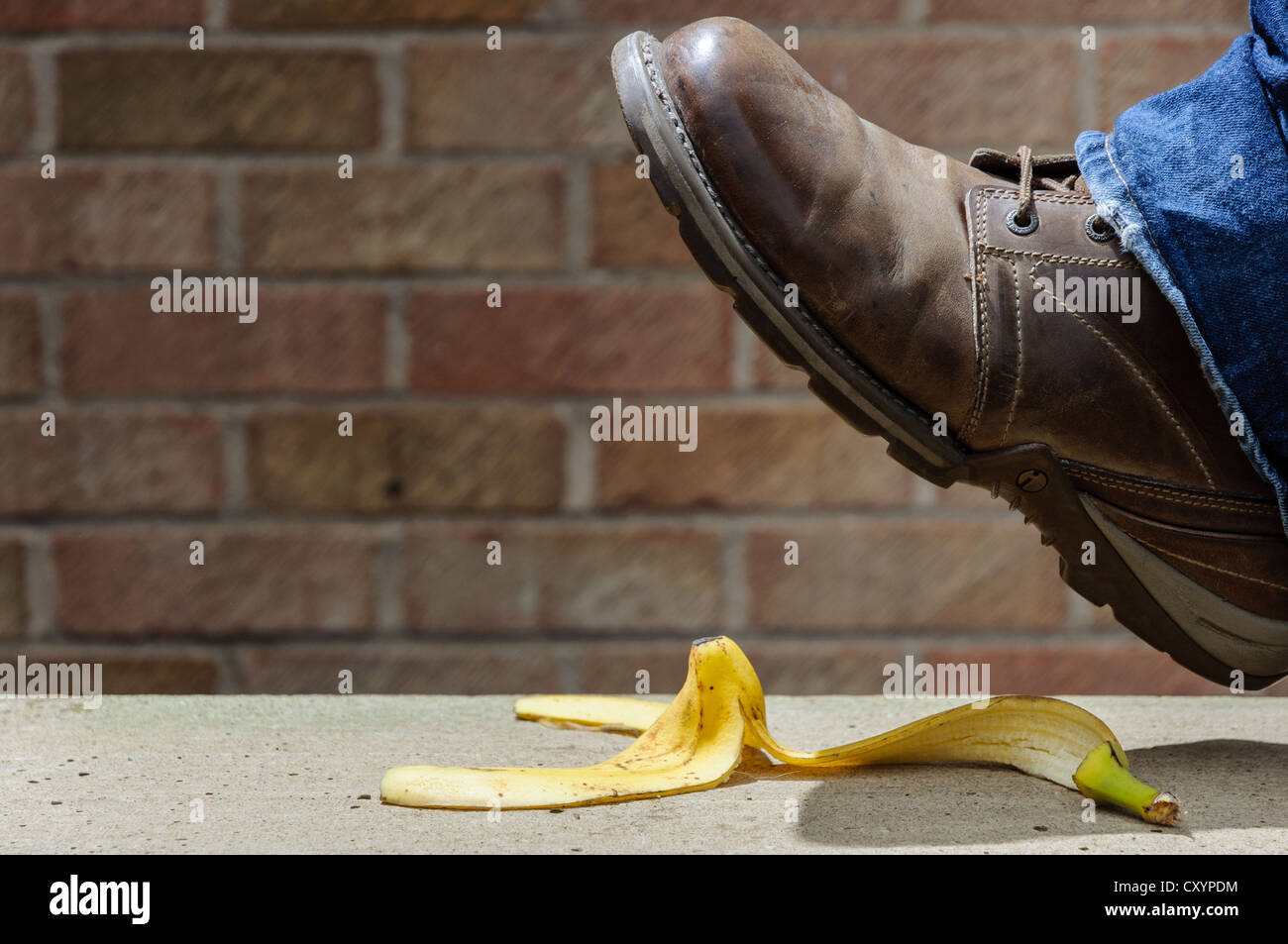 Slipping on a banana skin Stock Photo Alamy