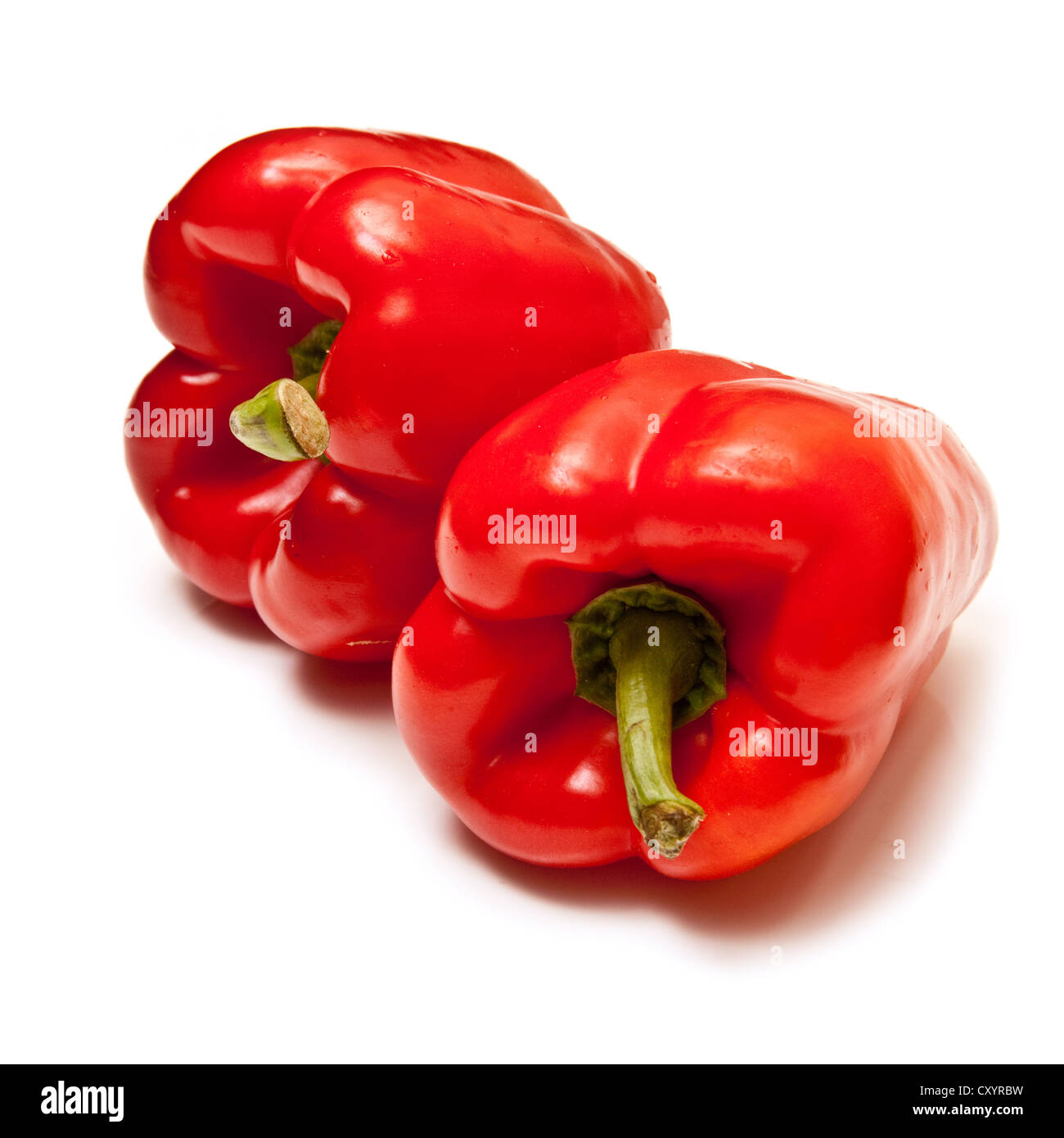 Red bell peppers isolated on a white studio background Stock Photo - Alamy