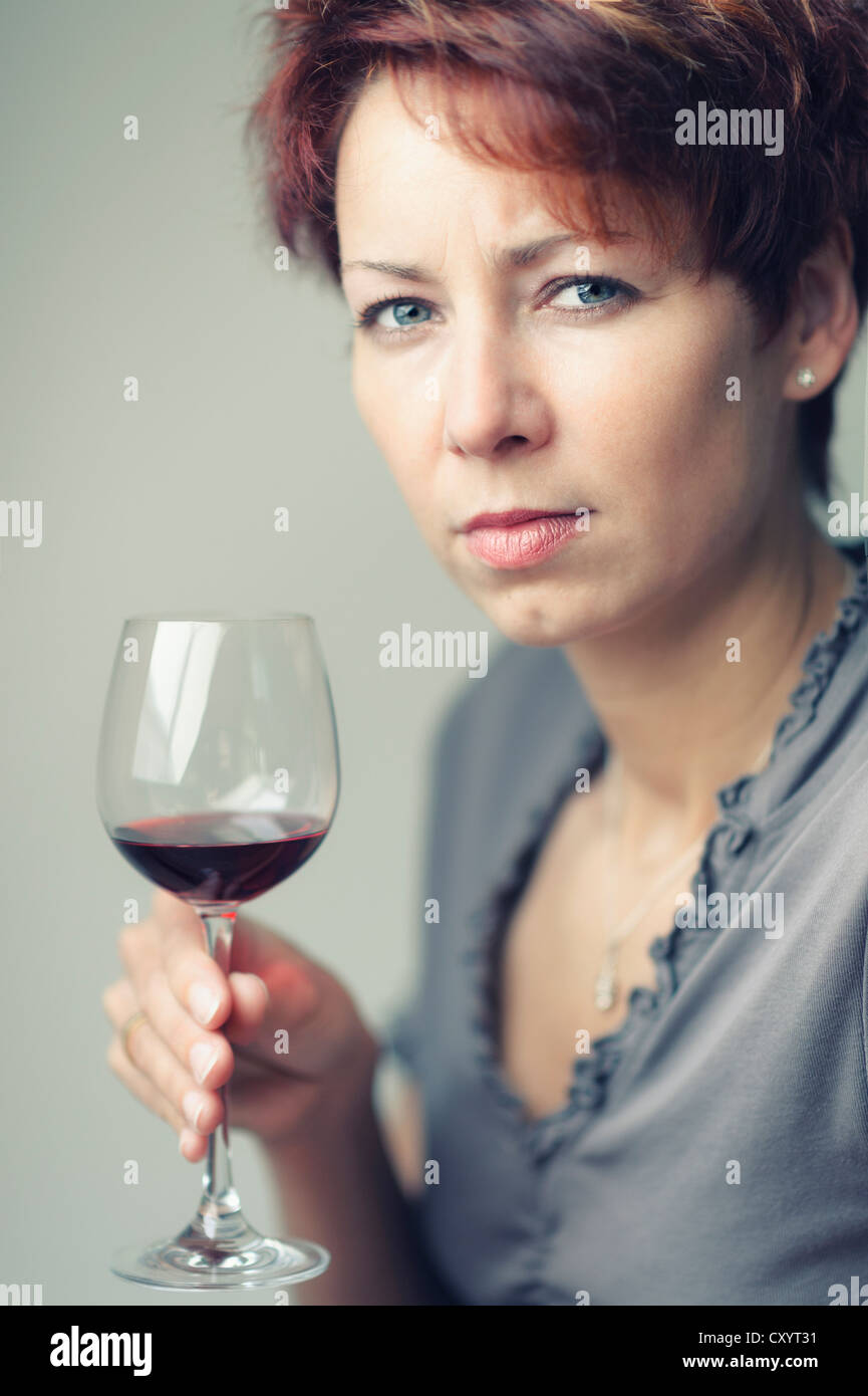 Young woman with a glass of red wine Stock Photo