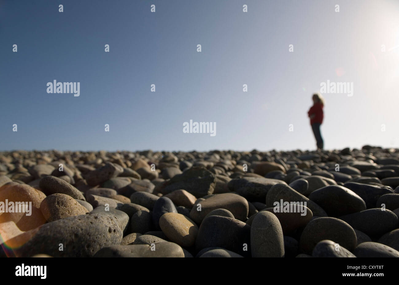 Walking on deserted beach in Wales Stock Photo