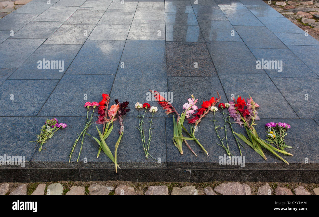 Flowers on the Khatyn Memorial, built to remember the Belarussian fallen of the Great Patriotic War. Stock Photo