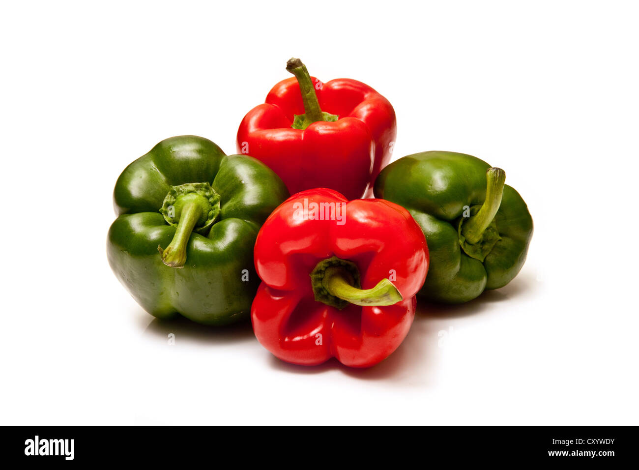 Red and Green Bell peppers isolated on a white studio background Stock ...