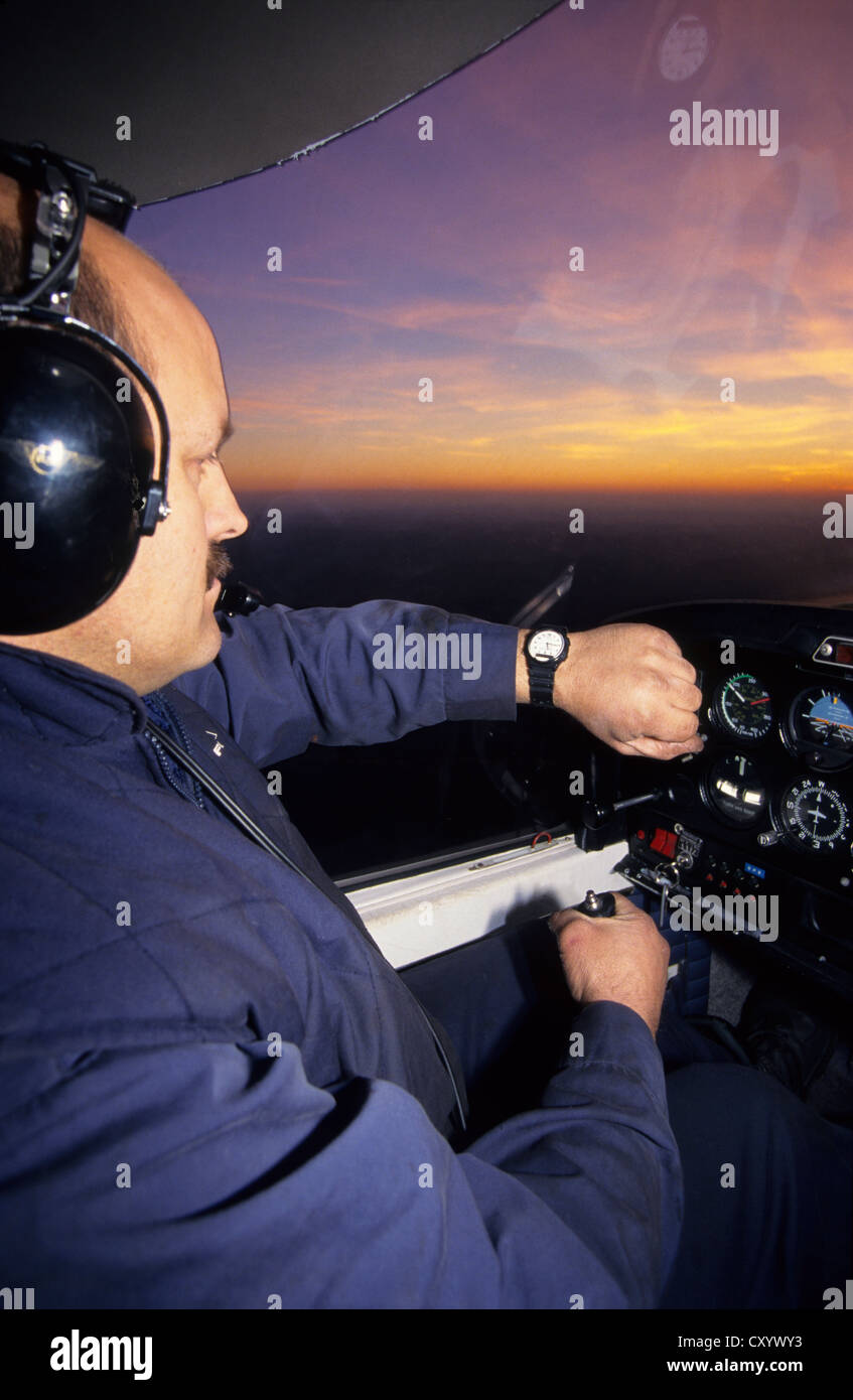 French pilot flying at dusk on a plane Robin DR400-120, France Stock Photo