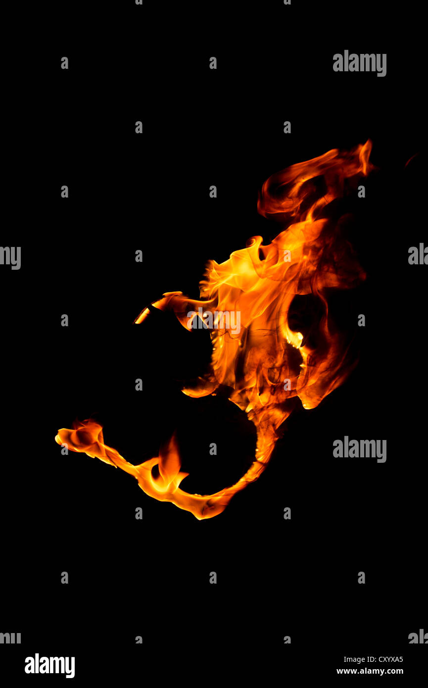 Hindu OM / AUM fire in front of black background Stock Photo