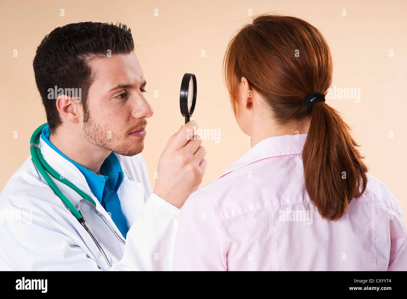 Dermatologist Examining A Suspicious Skin Area Of A Patient With A ...
