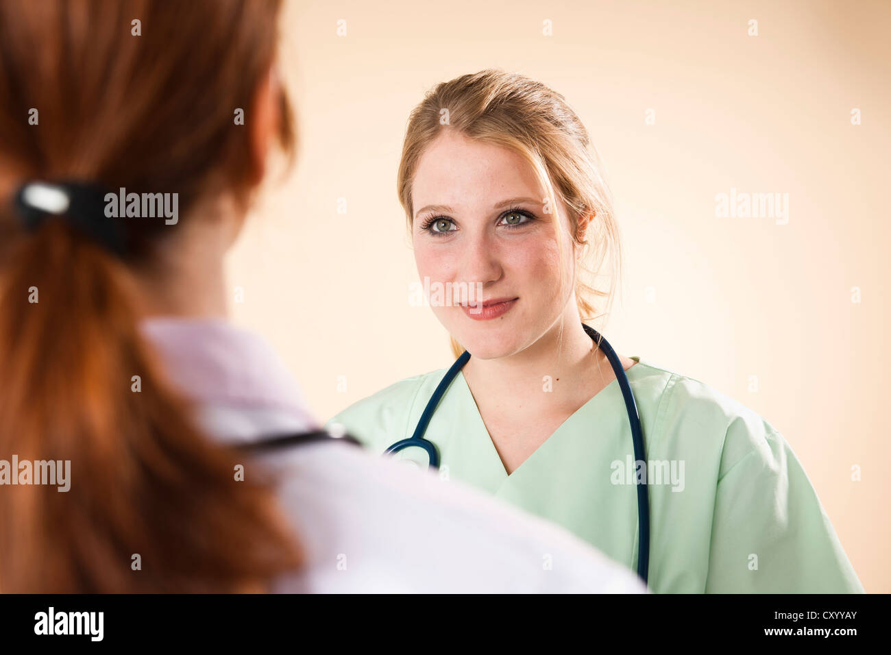 Nurse speaking young family hi-res stock photography and images - Alamy