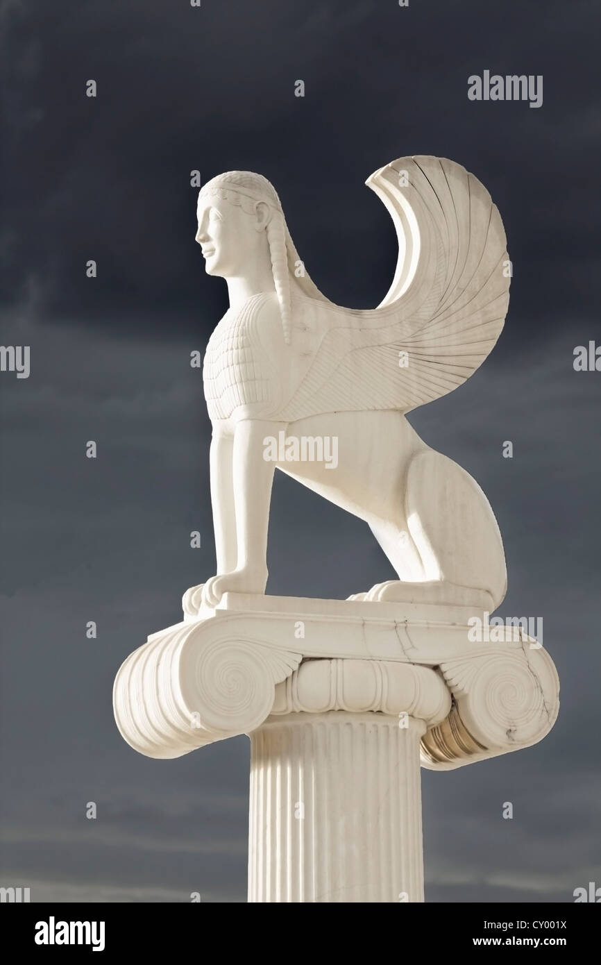 Greek Sphinx statue standing on top of a ionic order pillar on a cloudy ...